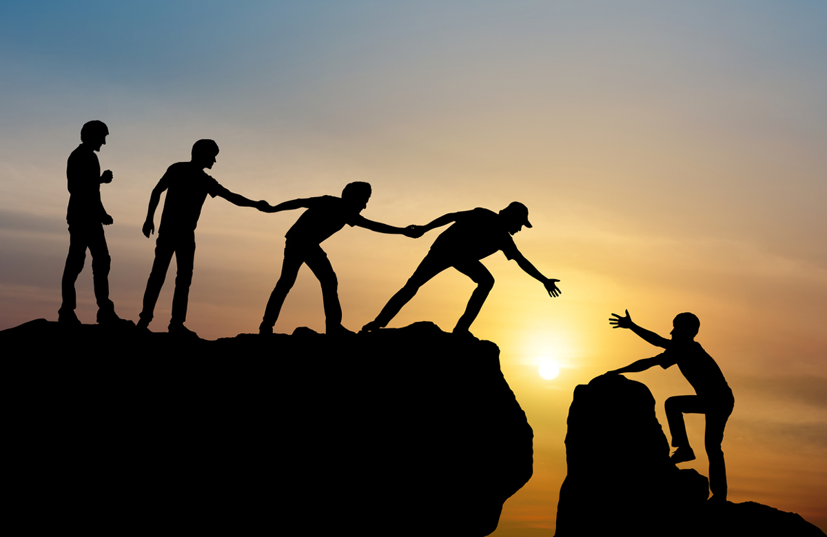 helping hands climbing mountain