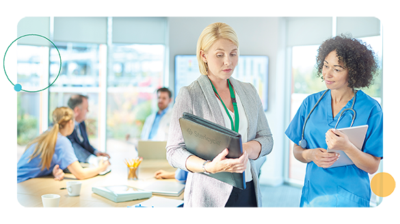 Employees sitting around a table