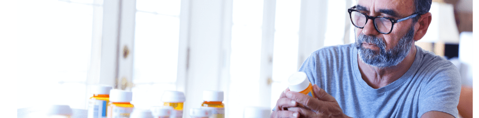 Man Reviewing Prescription Medications